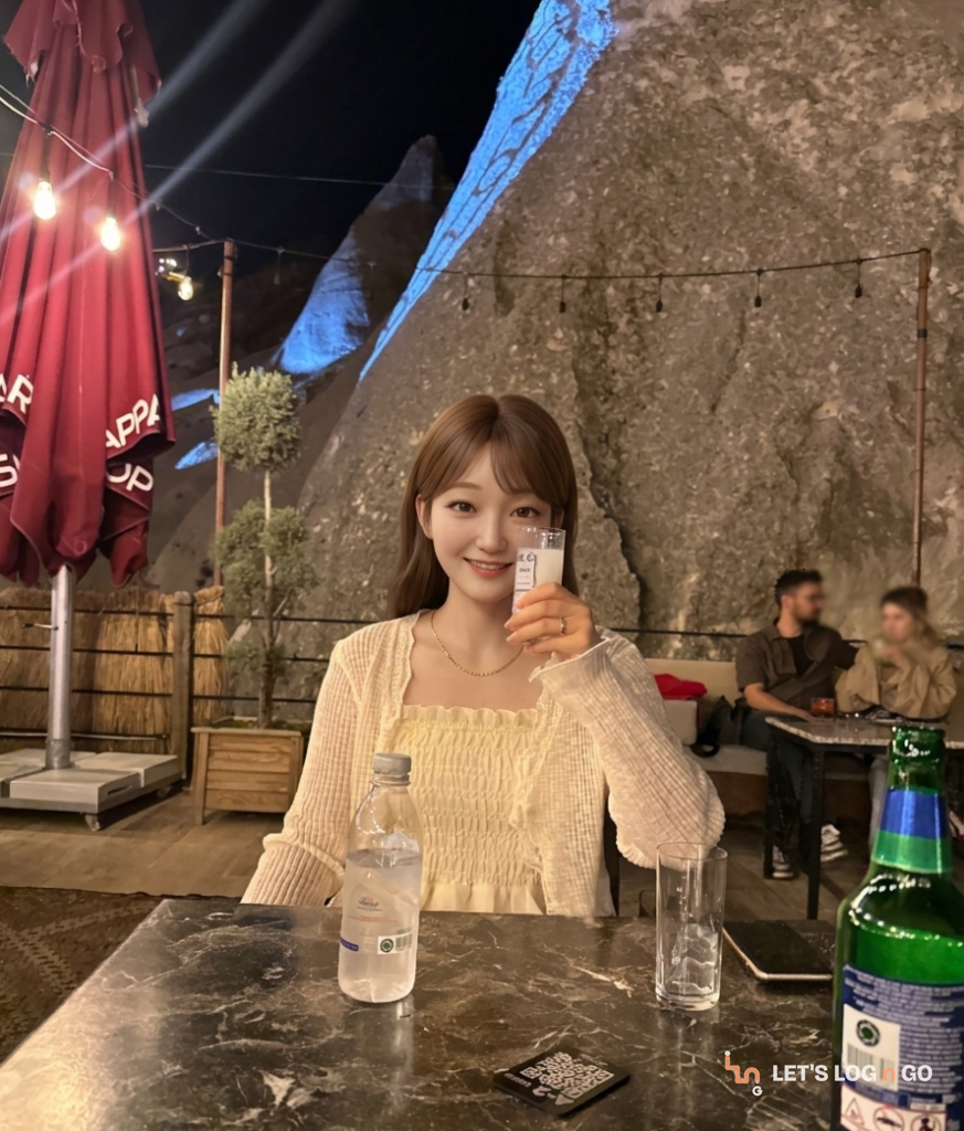 Raising a glass of milky rakı on a rooftop terrace in Göreme, Cappadocia